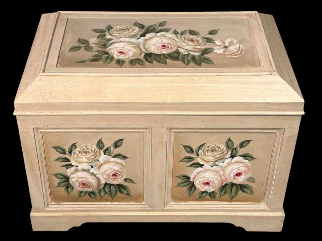 Large Hand-Painted Rose Decorated Storage Chest: Storage chest featuring delicate hand-painted cream roses with pink centers and green foliage on a cream-colored ground. Three decorative panels showcase bouquets of roses - one on the lid and two on