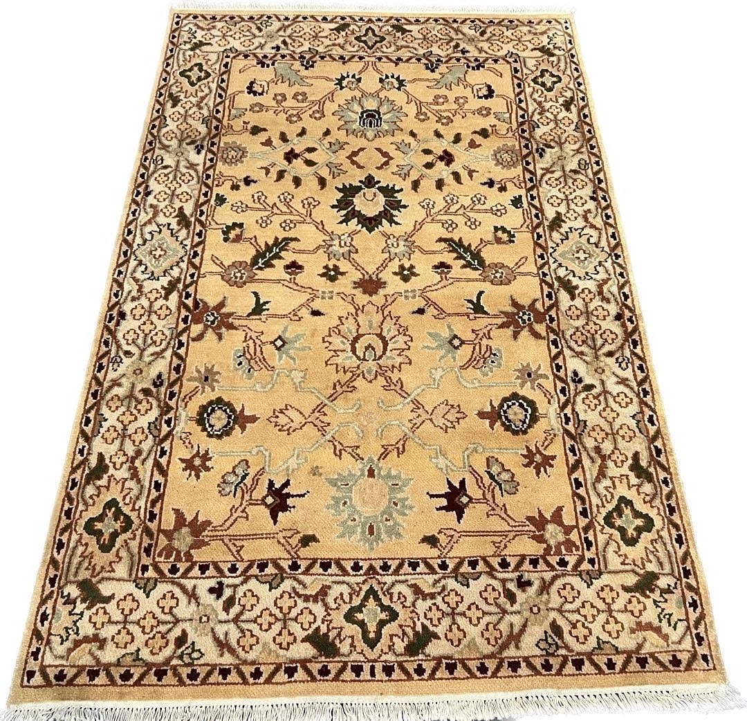 Agra Design Wool Area Rug 3'11" x 6'4": Elegant hand-knotted wool area rug featuring a traditional Agra design. The piece showcases a warm ivory field adorned with graceful floral motifs in harmonious shades of sage green, burgundy, and sof