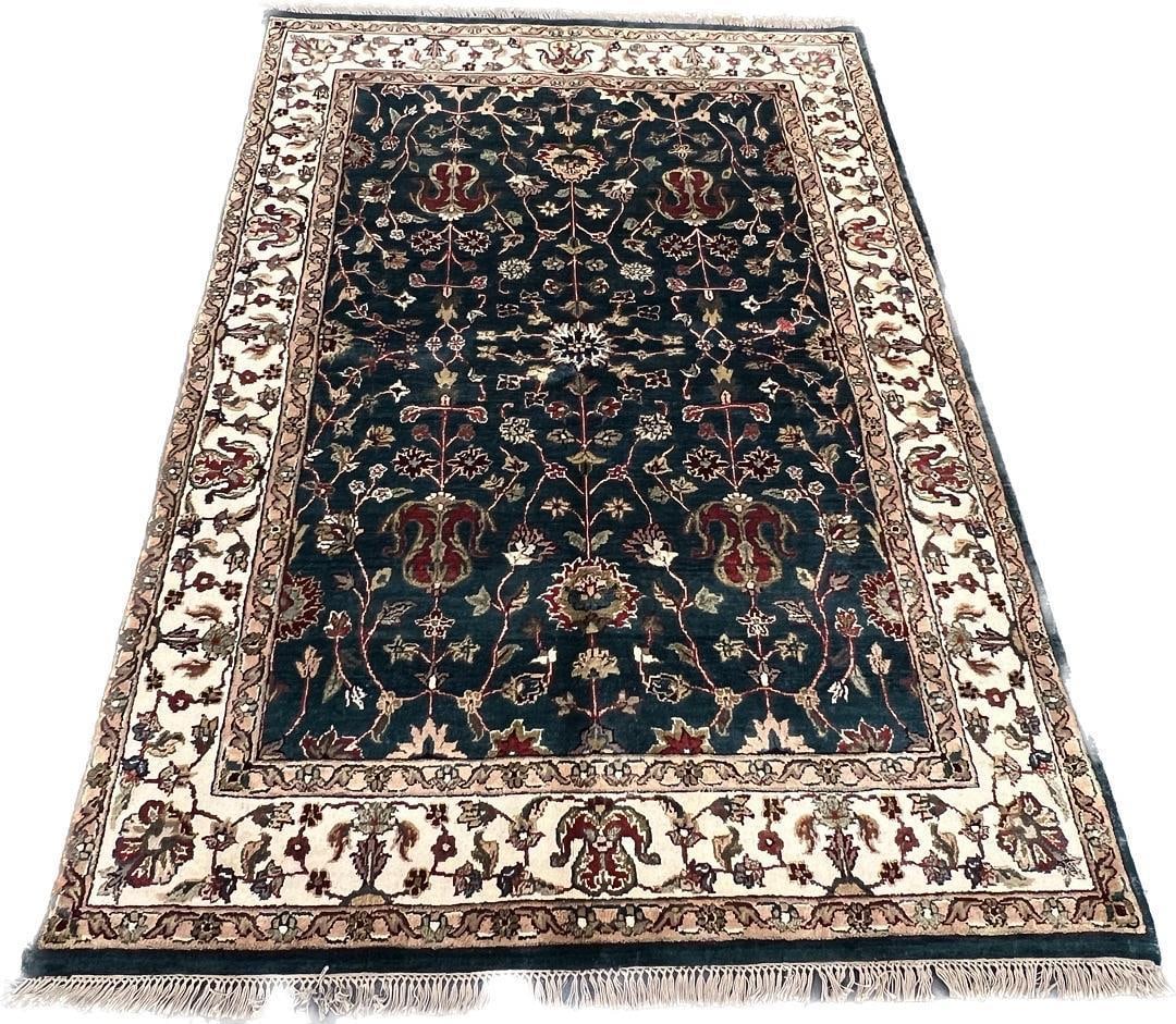 Khorasan Design Hand-Knotted Wool Area Rug, 5.0 x 7.0: Hand-knotted wool area rug in the Khorasan design, identified on the attached label as originating from India and sized 5.0 x 7.0. The rug features a deep blue field with an ivory border, an allover f