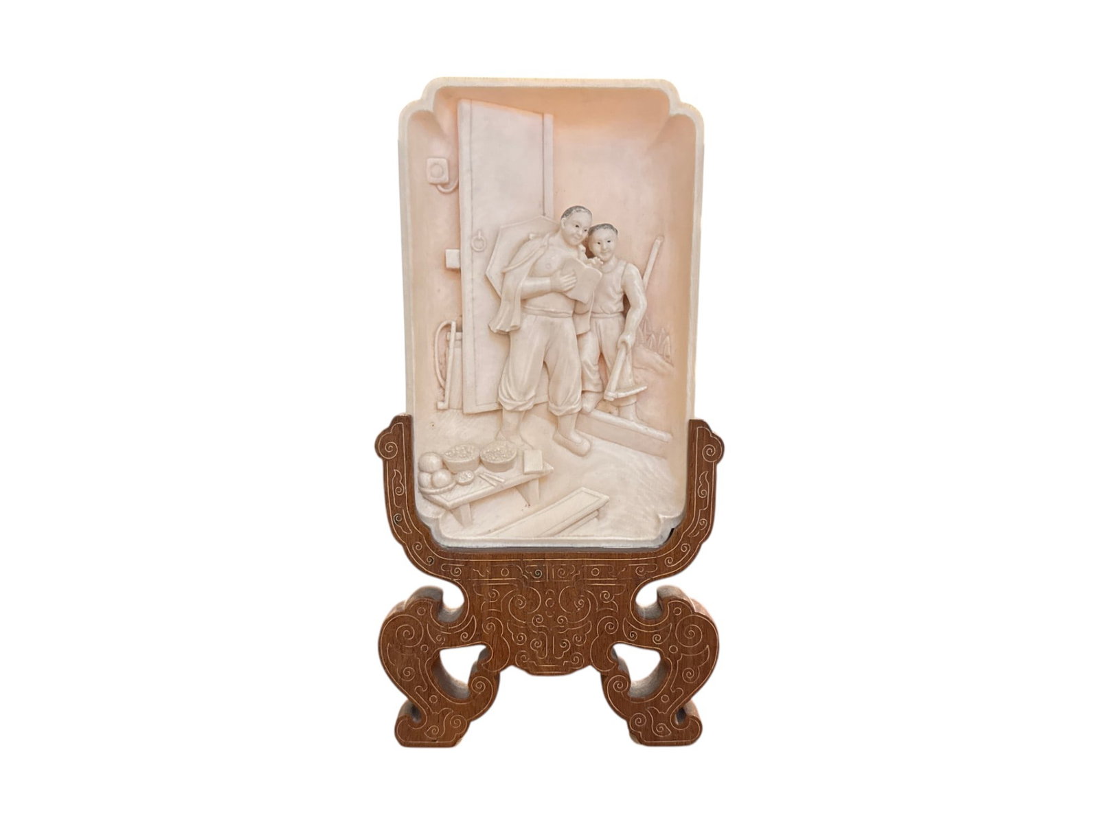 Carved Relief Plaque with Figures and Wood Stand: Carved relief plaque depicting two figures emerging through a doorway, one carrying a book and the other holding a handled tool, set within an interior scene that includes a low table with fruit or of