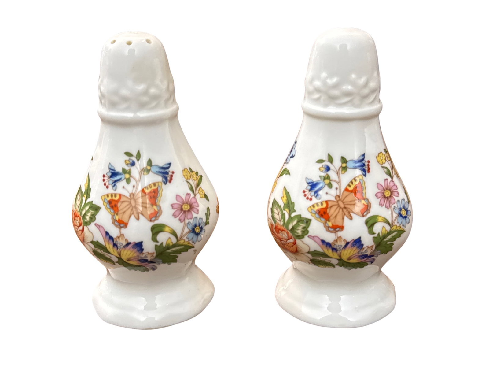 Aynsley (England) “Cottage Garden” Bone China Salt & Pepper Shakers, Pair, 4" H: A finely potted Aynsley “Cottage Garden” bone china salt and pepper shaker pair, made in England, decorated in bright enamel colors with a continuous garden vignette of butterflies and cottage