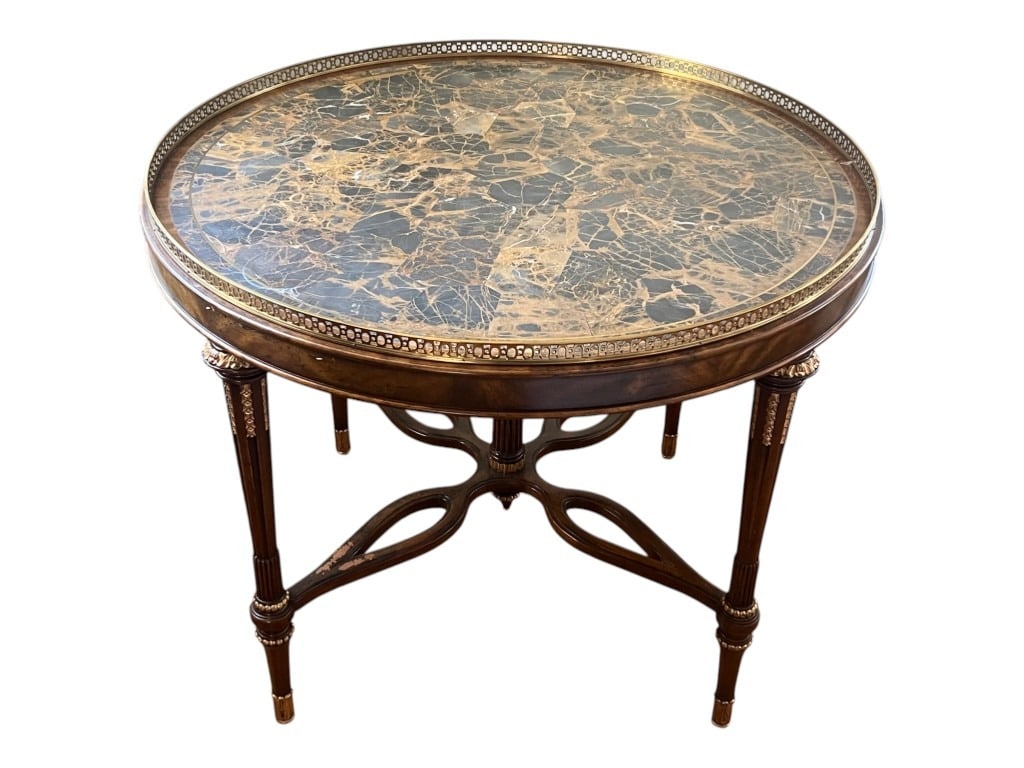 $3,800 Maitland-Smith Round Faux-Marble Inset Console Table with Brass Pierced Gallery, 32": A Maitland-Smith neoclassical-style round console table, hand made in the Philippines, distinguished by its stone-simulant inset top and gilt-metal detailing. The circular surface presents a