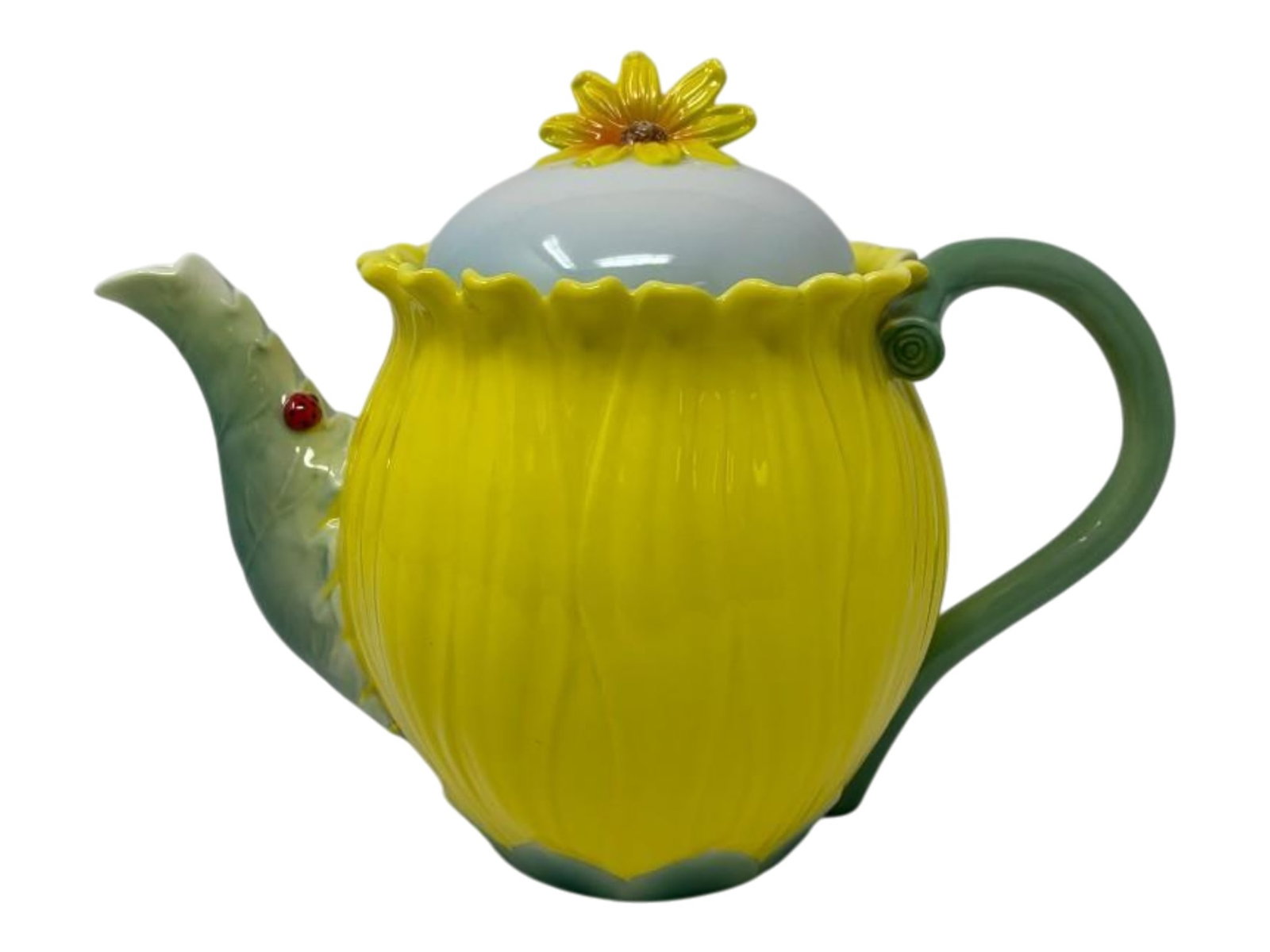 Small Porcelain Sunflower Teapot: Small Porcelain Sunflower Teapot. Raised relief porcelain in majolica style, with bright yellow, green and white glaze. Adorable lady bug detail on the spout! 4 x 4 x 6