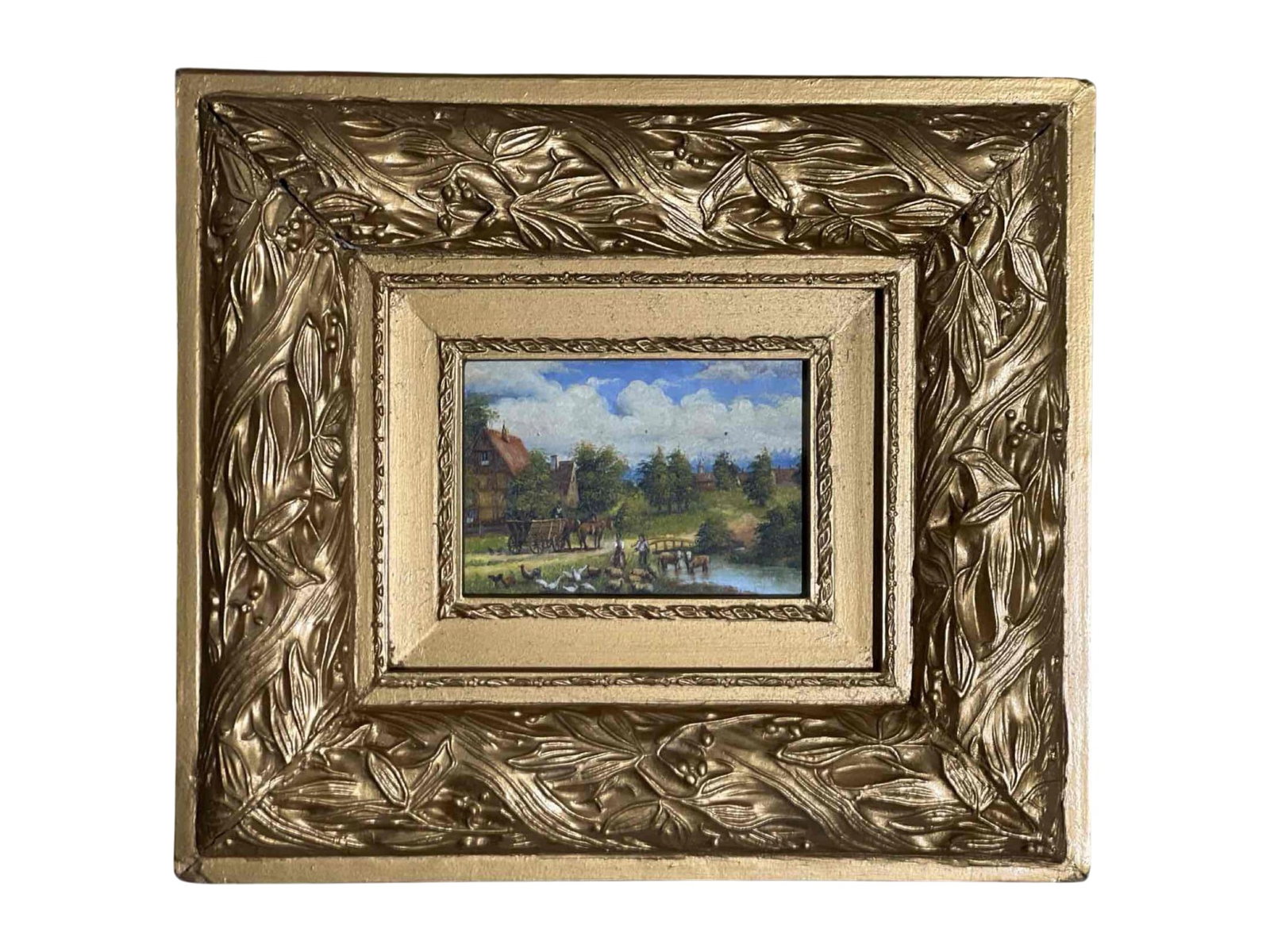 Framed Rural Landscape Oil Painting with Gilded Leaf Motif Frame: This oil painting depicts a bucolic rural scene featuring a horse-drawn wagon, farm animals, and figures near a stream with homes and trees under a partly cloudy sky. The artwork is set within a
