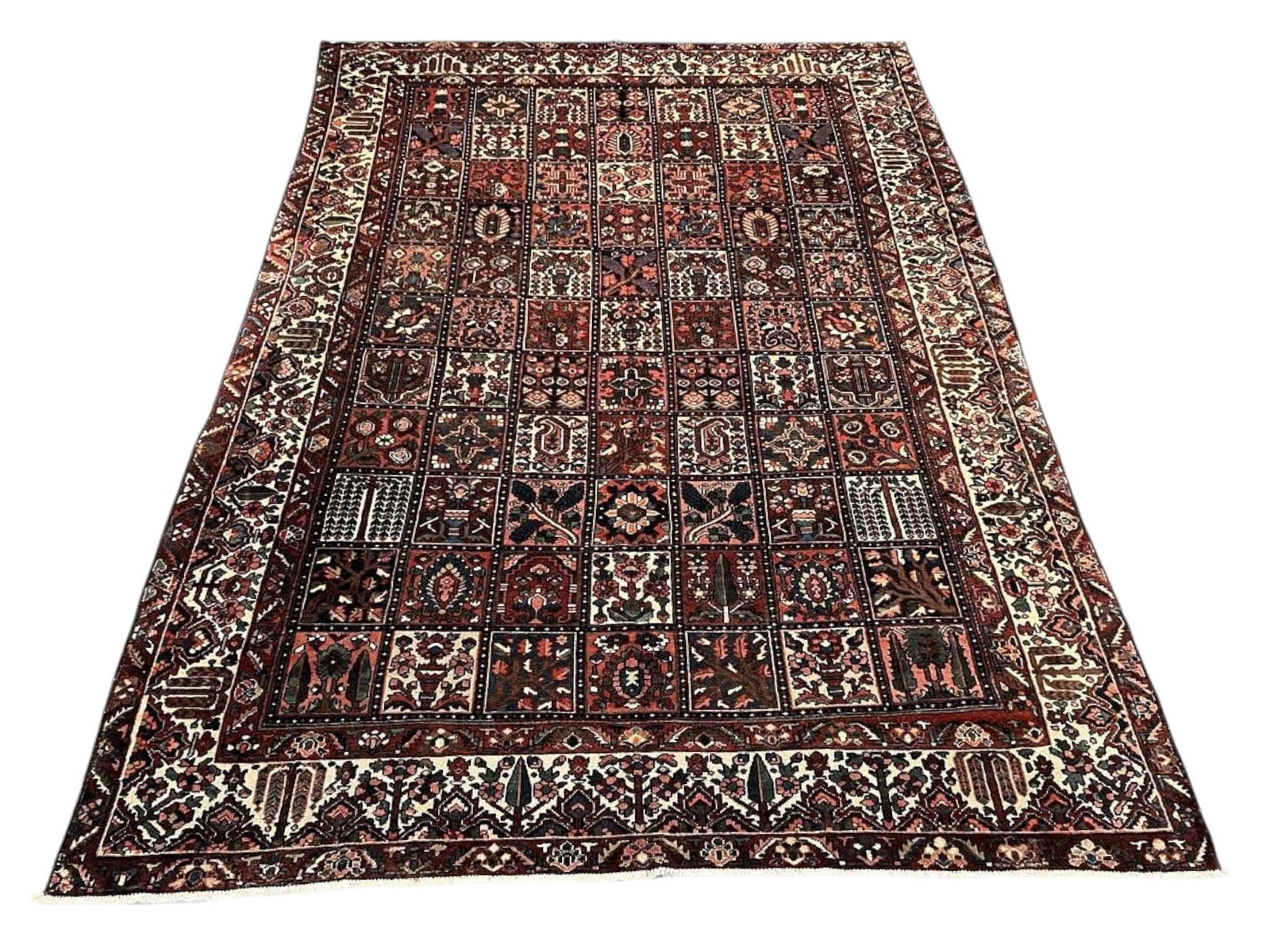 $6,960 - Garden Compartment Persian Bakhtiari Carpet, Hand-Knotted Wool, 10'4" x 14'7": $6,960. The classic khesti or garden panel layout, the field divided into a grid of rectangular compartments each planted with its own motif: weeping willow, cypress, vases of blossom and geometric ro