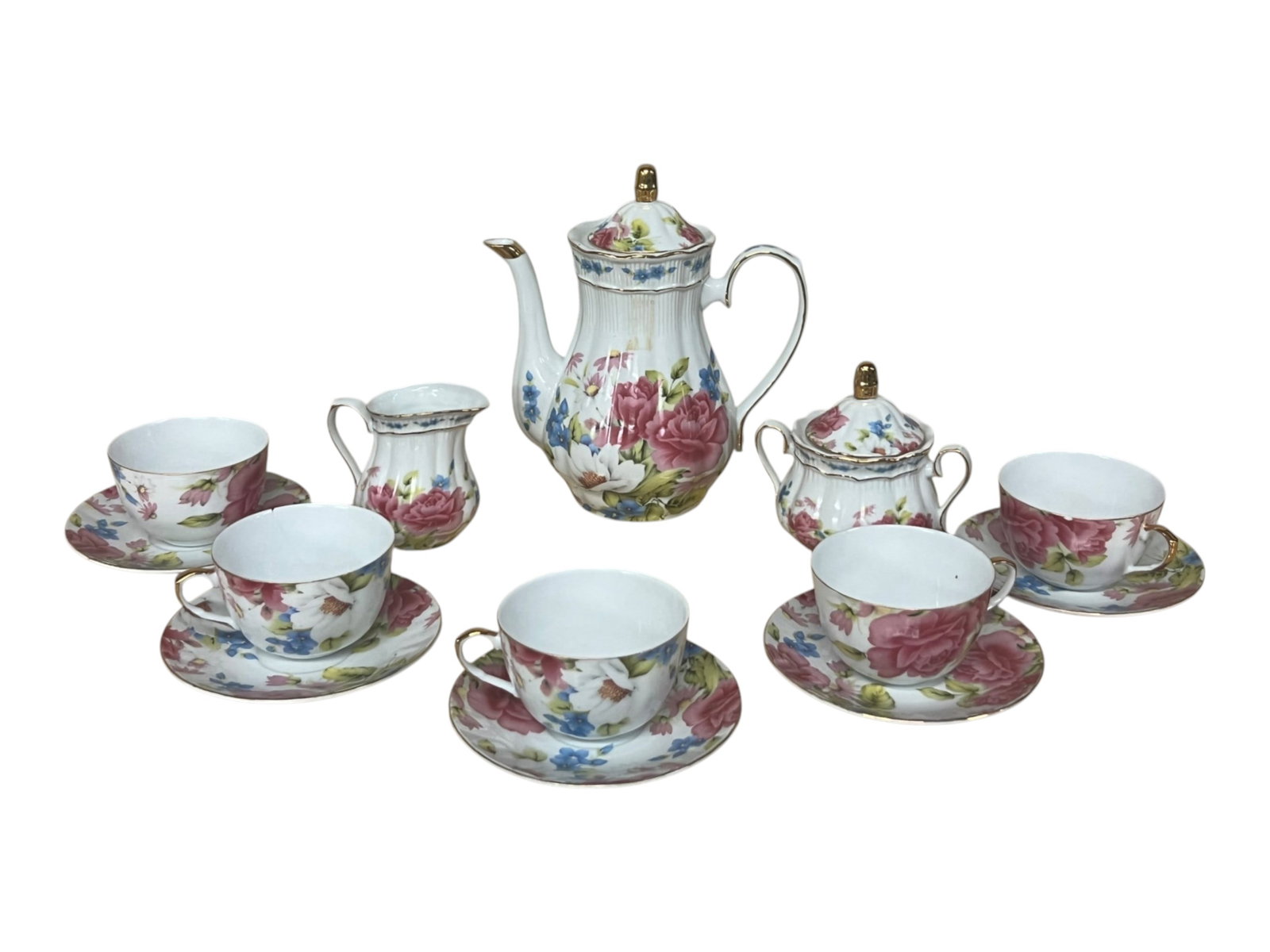Italian Porcelain Tea Service with Polychrome Rose and Wildflower Decoration and Gilt Accents, 15 Pi: This fifteen piece tea service presents a full chintz style floral decoration across white porcelain, with cabbage roses in deep pink, cornflower blue blossoms, white magnolias, and trailing green fol