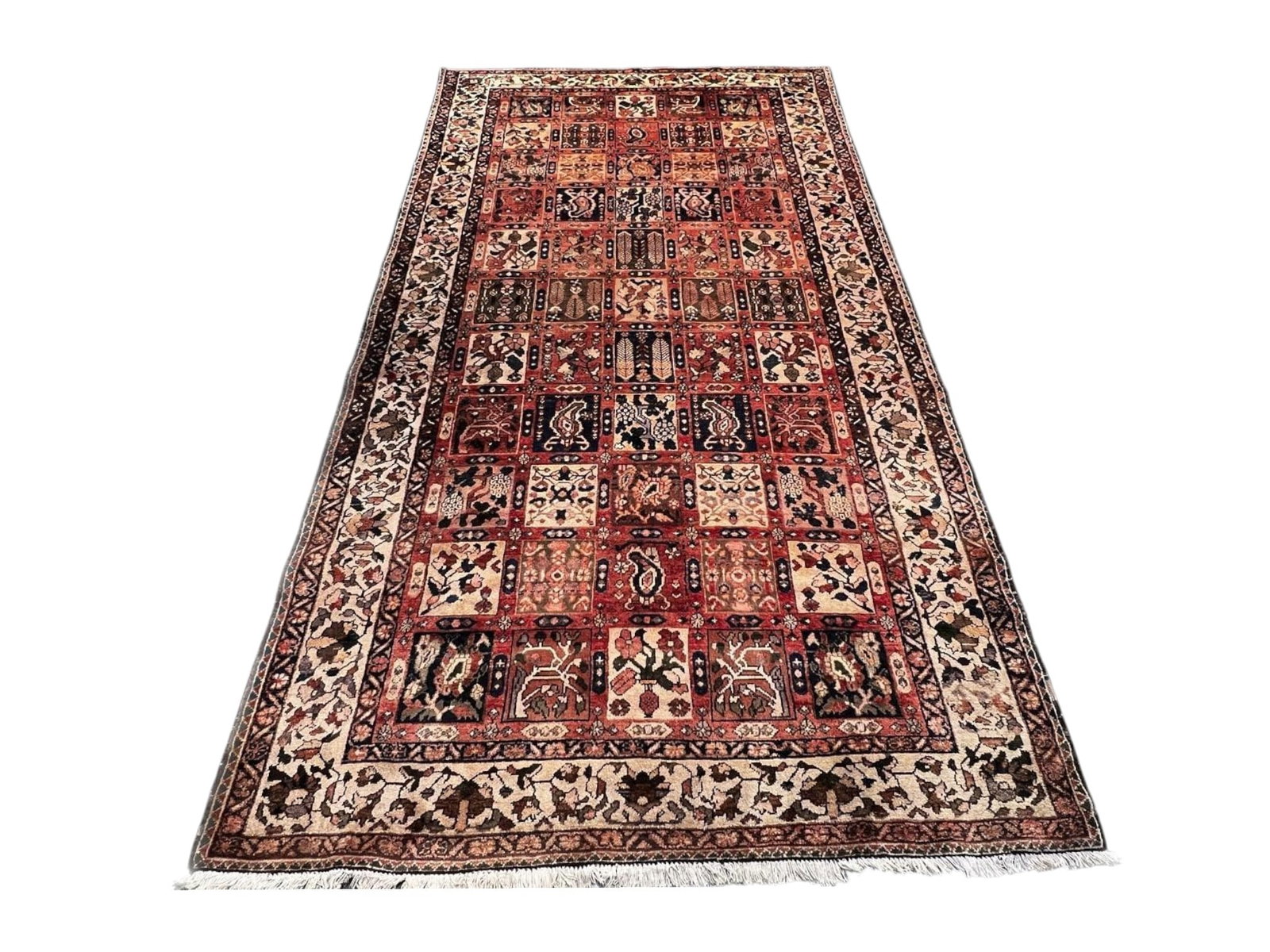 $2,070 - Panelled Garden Persian Hamedan Runner, Hand-Knotted Wool, 5'4" x 10'1": $2,070. The red field is divided into a grid of small panels, each carrying its own boteh, cypress or geometric device in ivory, navy and rust, framed by an ivory border of flowering vine. The garden 