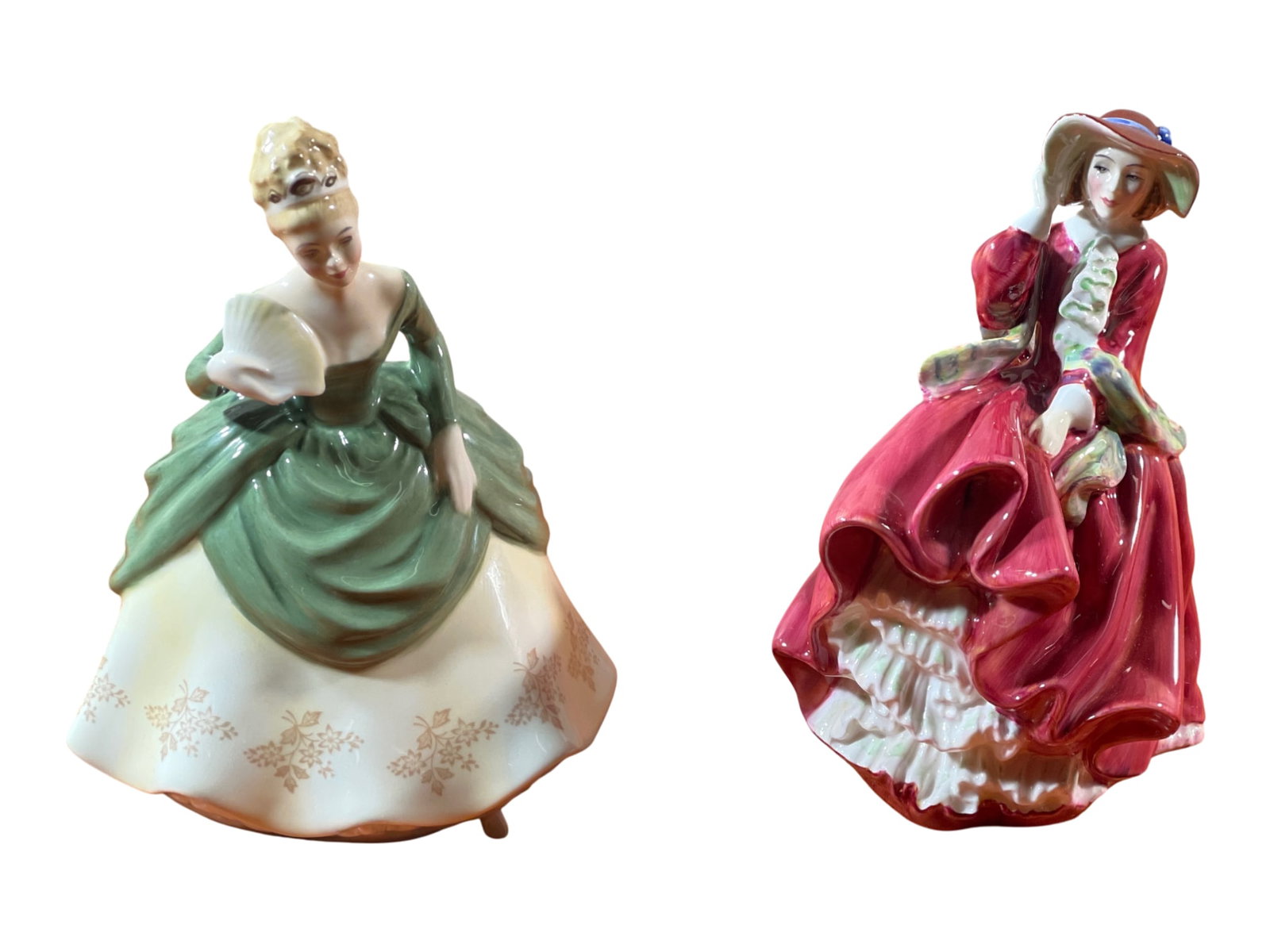 Two Royal Doulton Bone China Figurines: “Top o’ the Hill” and “Soirée&#: A matched group of two mid-20th-century Royal Doulton bone china lady figurines, each modelled with the firm’s characteristic emphasis on fluid drapery and high-gloss colorwork, and both bearing