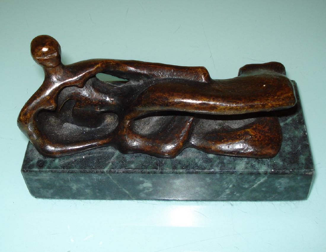 HENRY MOORE ENGLISH BRONZE NUDE SCULPTURE: Henry Moore (ENGLISH, 1898 – 1986). Bronze sculpture depicting an abstract nude. After Cast Signed Moore Bronze Size: 6.5"L Base Size: 7" x 3" x 1.25" apprx.