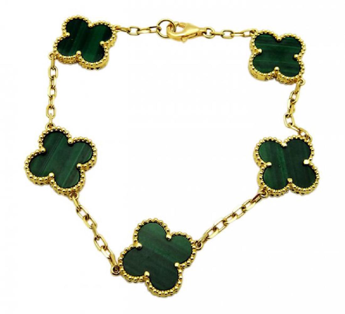 Van Cleef Vintage Alhambra Gold Malachite Bracelet: Van Cleaf & Arpels Vintage Alhambra Yellow Gold Malachite Bracelet Length: 7 inches, the weight is 10.4 g. Motif's measurements 14.5 mm