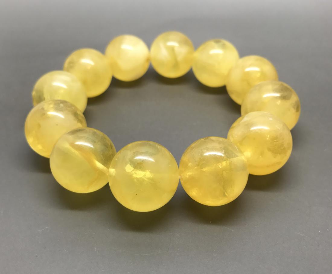Baltic Amber Bracelet Yellow Honey Lemon Colour: Materials: Baltic Amber, Colour: Yellow, Lemon, Honey, Shape: Round Beads, Size: 17mm (Please refer to the pictures), Total Weight: 34,5g
