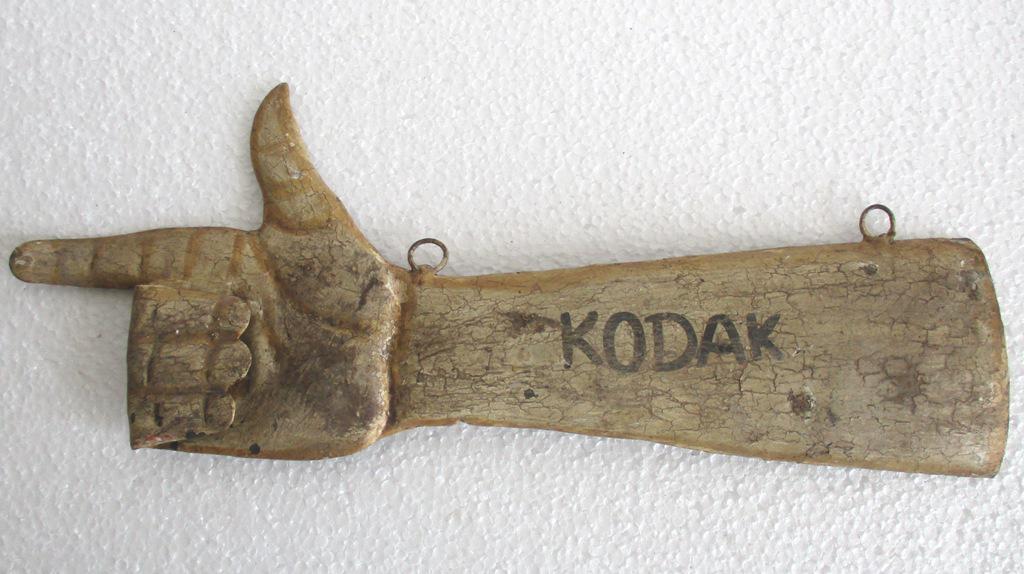 Iron hand direction trade sign hanging . KODAK (1 of 7)