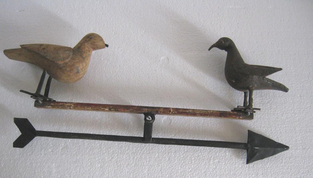 Iron and wood Dove on see saw: Iron and wood Dove on see saw . Size : 7.50 x 18.00 x 2.00 inch .