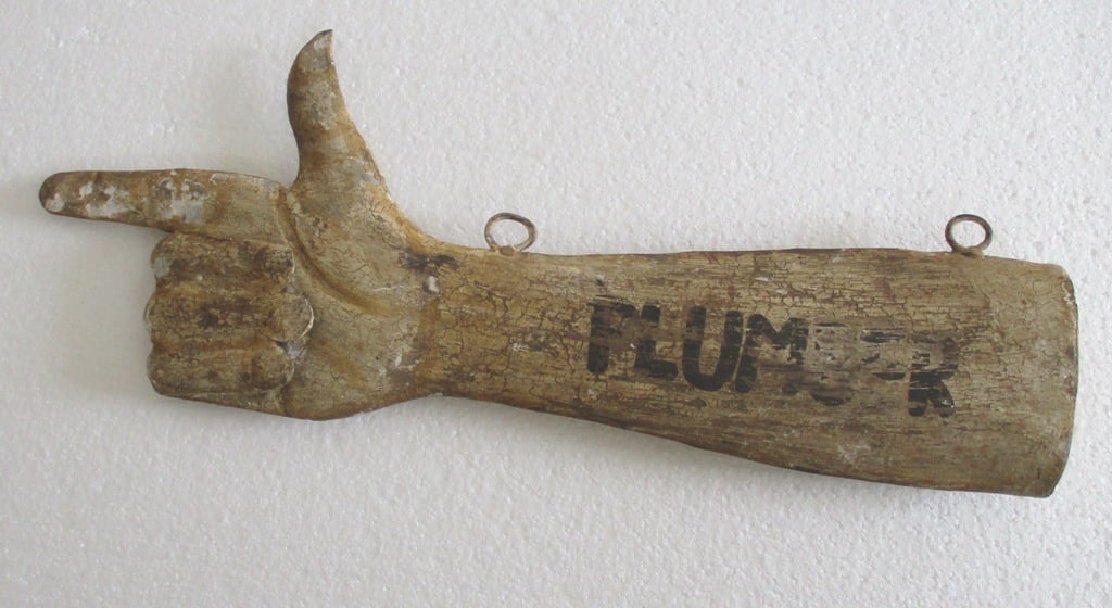 Iron hand direction plumber's trade sign advertisement (1 of 7)