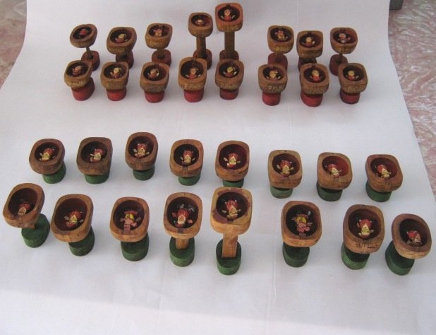 DANCING SANTA CLAUS CHESS SET: Amazing and beautifully made old wooden chess pieces with Santa Claus . The hands and legs of each piece are moving which makes it very exciting . All the pieces are Santa Claus except for all four ro