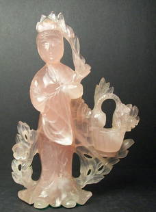 A Finely Chinese Carved Rose Quartz Flower And Fairy Est: $80 - $200 Passed: 粉晶石雕提篮牡丹仙子：A finely Chinese finely carved rose quartz flower and fairy Size:14.5cm x9.5cm Dimensions 14.5cm x9.5cm