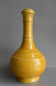 A yellow-glazed sea-beast pattern washing bottle made in the Kangxi year of the Qing Dynasty