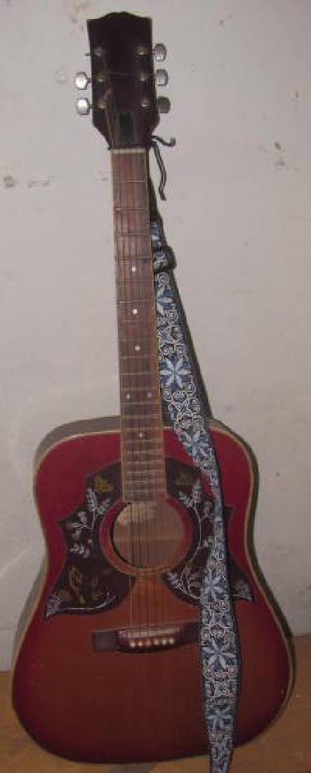 Acoustic Guitar: Has some wear