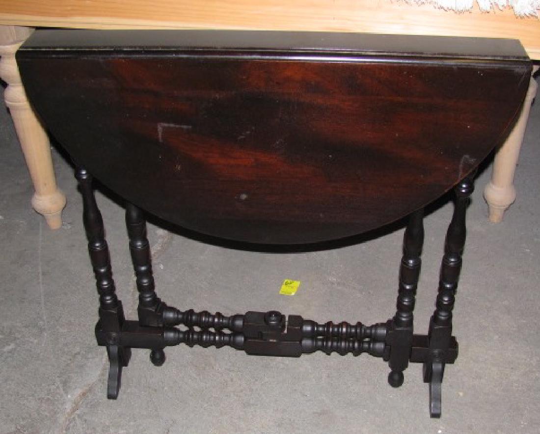 Gate Leg Drop LeafTable: Opened it is approx. 29 1/2" in diameter and 28 1/2" tall.