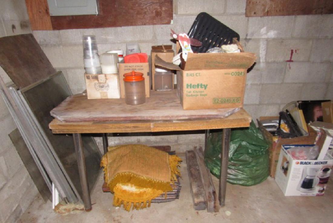 Contents along basement wall. (1 of 7)