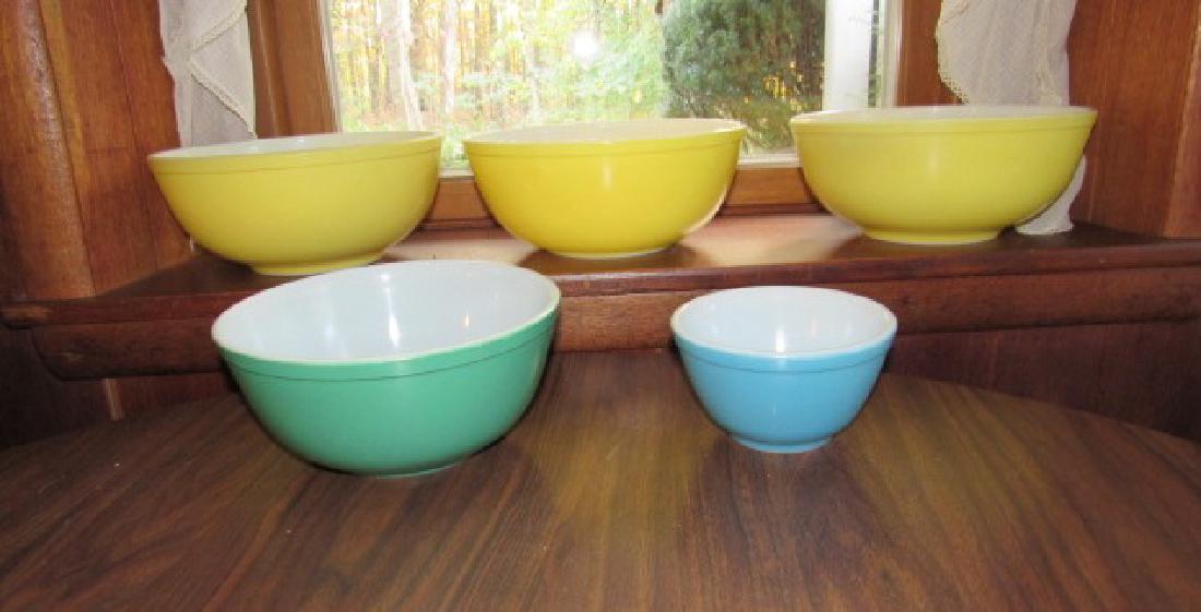 10 Pyrex Mixing Bowls: Largest ones are approx .10 1/2" in diameter and 3 small blue ones are 5 3/4" in diameter. They do have some paint loss.