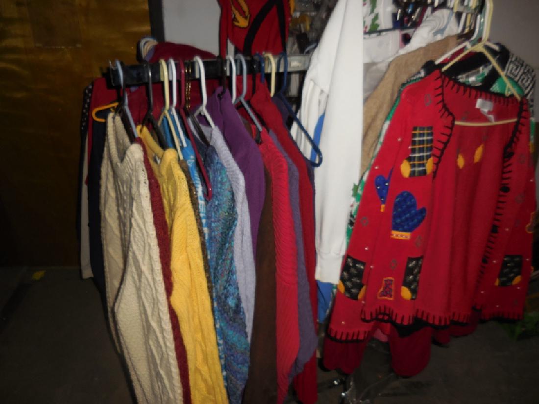 Rack of Clothing: Sweaters, leather jacket, etc