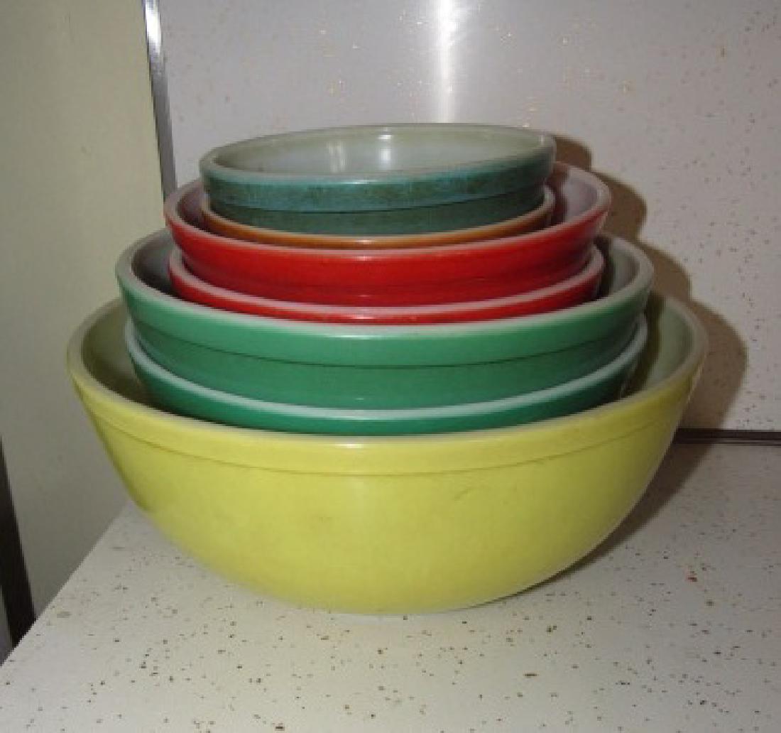 Lot of Pyrex Mixing Bowls: Largest yellow one is approx. 10 1/2" in diameter and smallest one is approx. 5 5/8" in diamter. 7 total