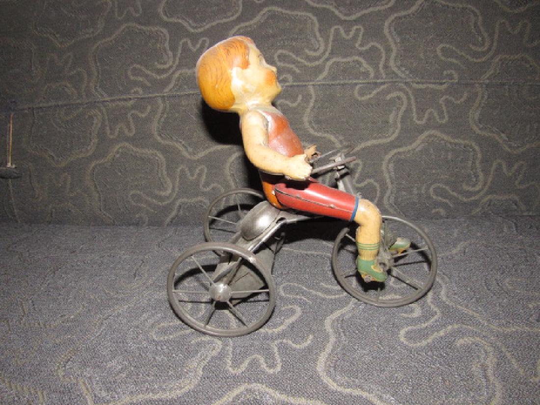 Tin Wind Up Tricycle Toy: Approx. 8 1/4" long, 4 1/2" wide, and 9" tall. It does wind, tires will turn, but will not move across floor , once placed down.