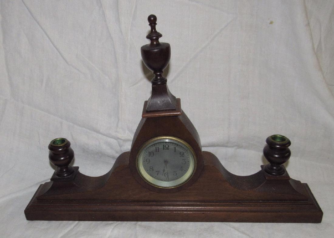 New Haven Mantle Clock w/ Candle Holders: Approx . 20 1/2" long, 13 1/2" tall. Sold in untested condition.