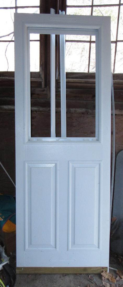 Storm Door: Approx. 28 7/8" x 79". Looks like they may have tried installing it, but does not look used.