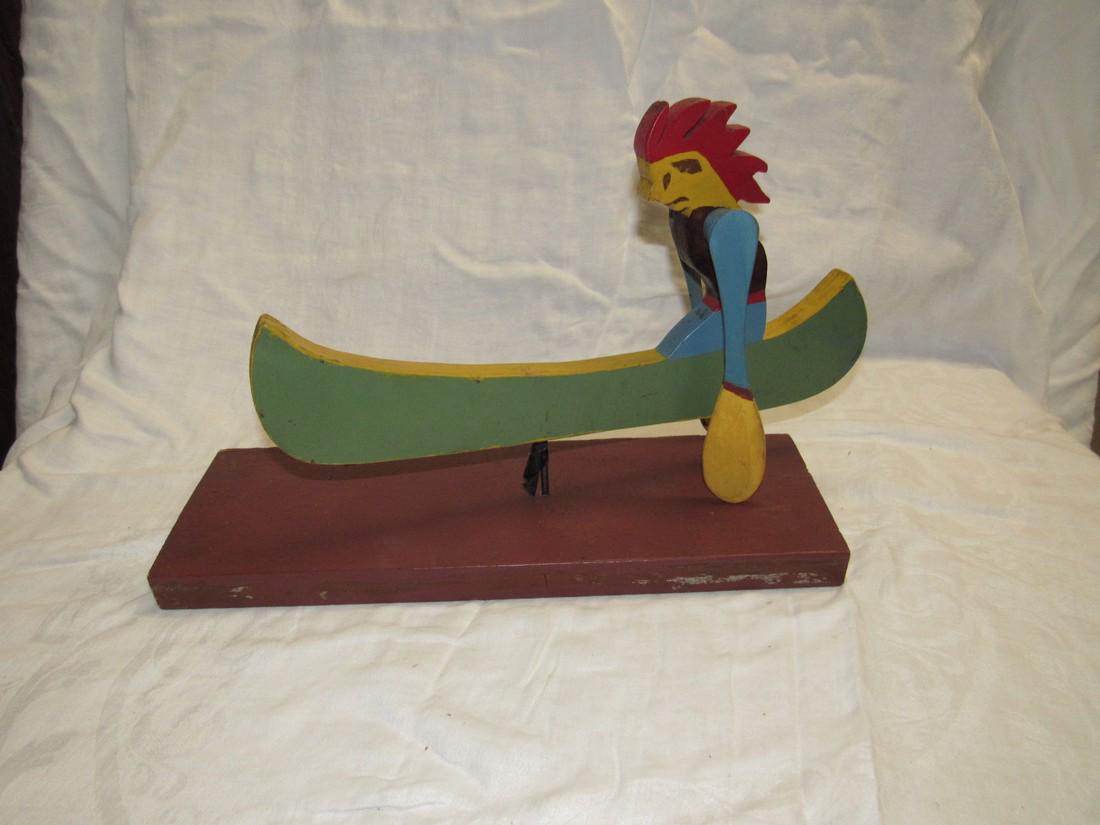 Folk Art Indian in Canoe Whirly Gig: Approx. 15" long.
