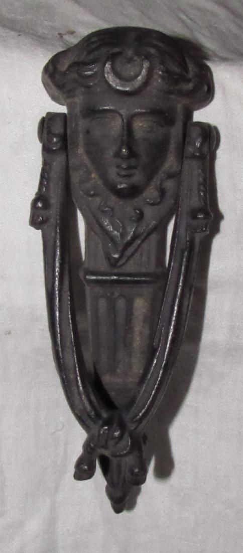 Cast Iron Door Knocker: Approx. 9" long.