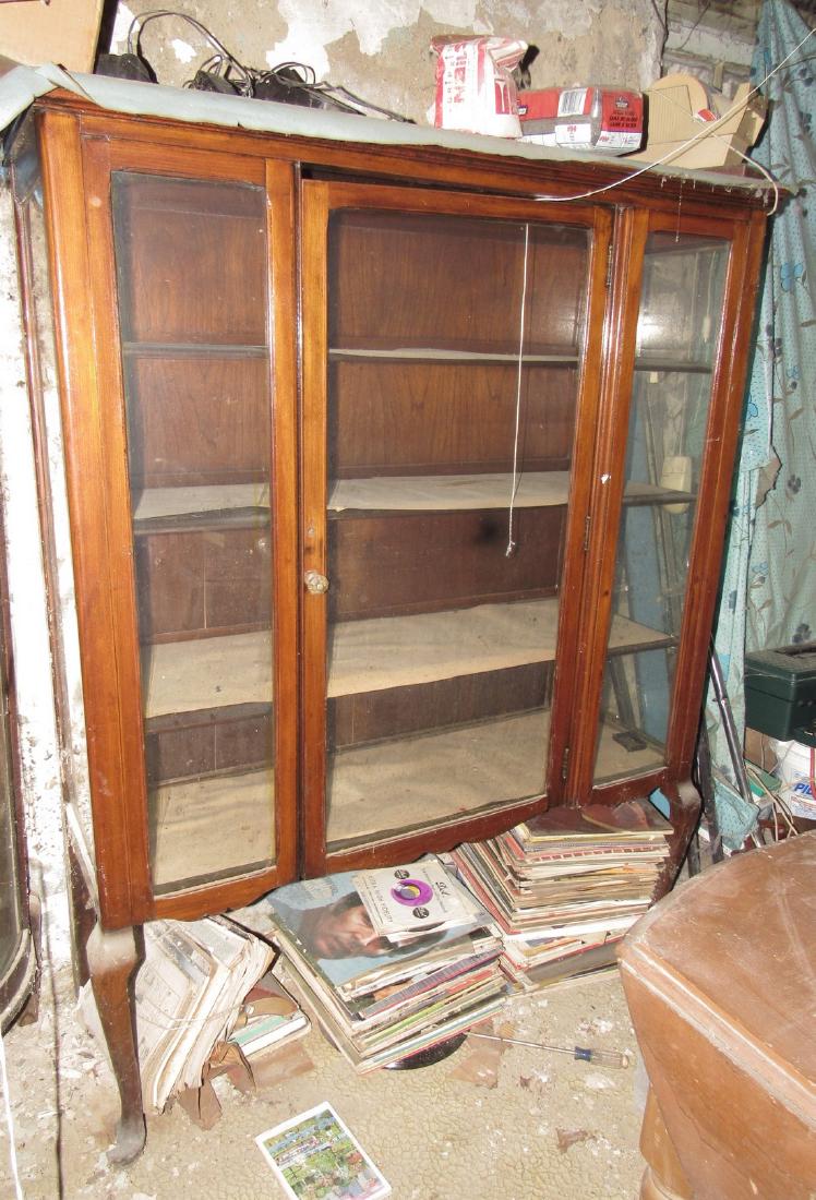 China Closet and Drop Leaf Table: China is approx. 15" x 46" x 60" tall. Also includes items on top and drop leaf table. To be removed from basement