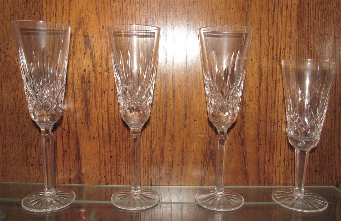 4 Waterford Crystal Glasses: 3 are approx. 8 3/4" tall and 2 1/2" in diameter. The other is approx. 7 3/8" tall and 2 1/2" in diameter