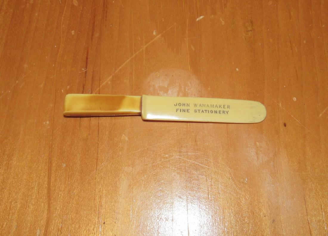 John Wanamaker Bakelite ? Letter Opener: Possibly bakelite. Approx. 3 1/2" long