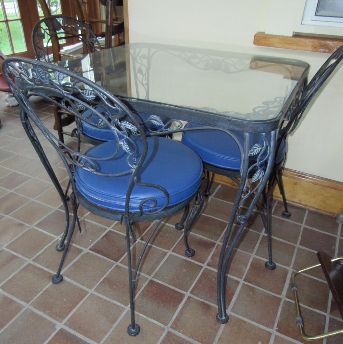 Wrought Iron Glass Top Patio Table and 3 Chairs: Table is approx. 32 1/2" Square and 29" tall. Comes with 3 chairs