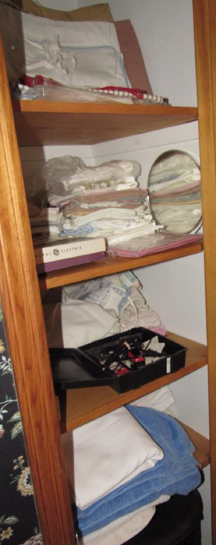 Contents of Bathroom Closet Towels Sheets Wahl Shaver (1 of 6)