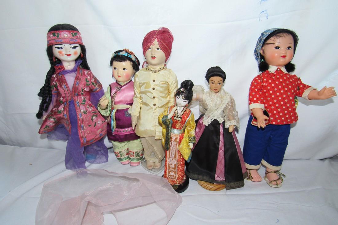 Rubber , Cloth , & Composition Oriental Dolls (1 of 3)