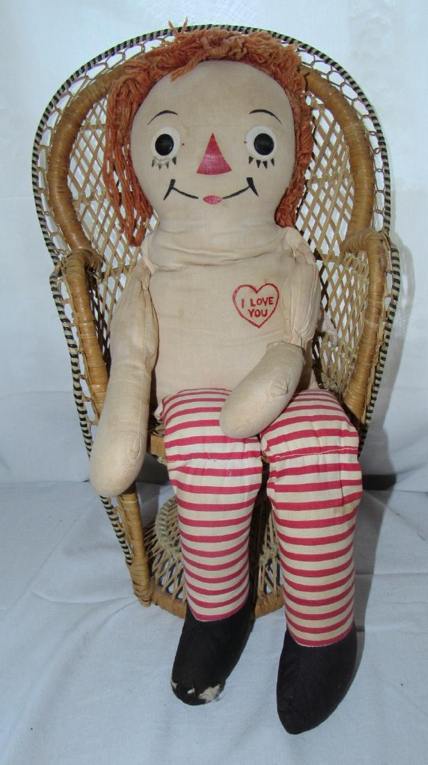 22" Raggedy Ann Doll with Wicker Chair: Has damage to foot & writing on it. Comes with chair