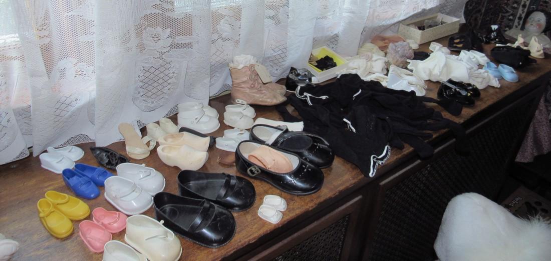 Large Lot of Doll Shoes Boots Leggings: Getting all pictured on top of radiator cover
