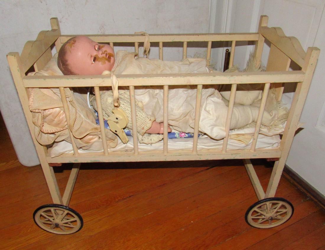 Composition Doll & Crib: Crib is approx. 13" x 27" x 23 1/2" tall. Doll has damage