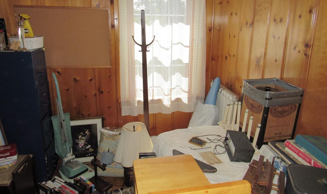 Partial Room Contents File Cabinet Books Shelves Lamp (1 of 9)