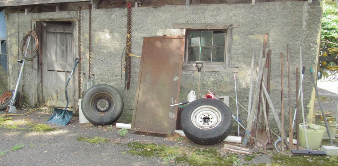 Outside Garage Wall Contents Log Rollers Scrap Iron (1 of 4)