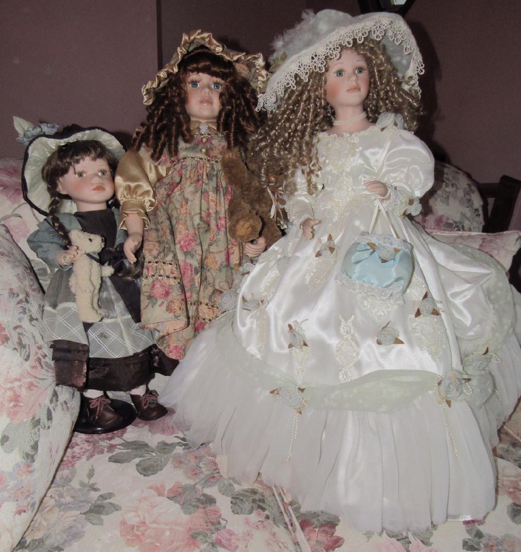 3 Dolls 1 Collectors Choice: The middle one is marked Collectors Choice. The tallest on right is approx. 27" tall