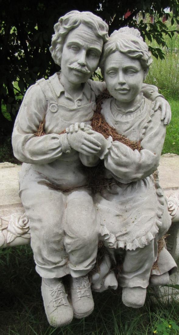 Man & Woman Sitting Concrete Statue: Approx. 24" tall. DOES NOT INCLUDE BENCH