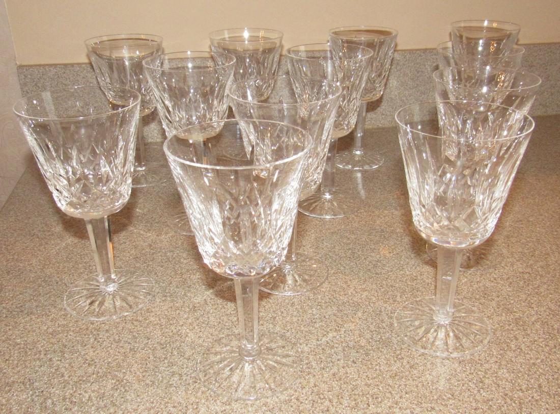 Set of 12 Waterford Crystal Wine Glasses: Approx. 3" in diameter and 5 7/8" tall. Marked Waterford. No chips or cracks.