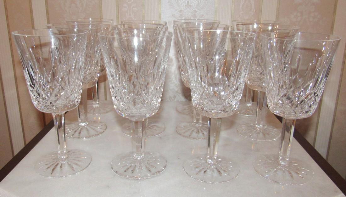 Set of 12 Waterford Crystal Wine Glasses: Approx. 3 3/8" in diameter and 7" tall. Marked Waterford on bottom. No chips or cracks
