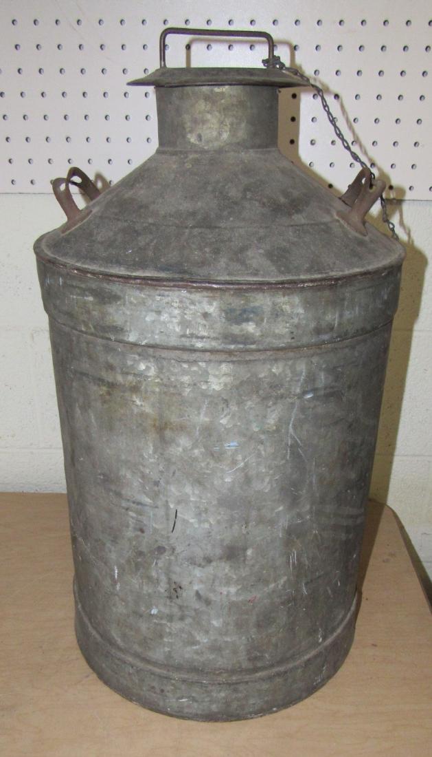 Antique Milk / Fuel Can: Approx. 13" in diameter and 24" tall.