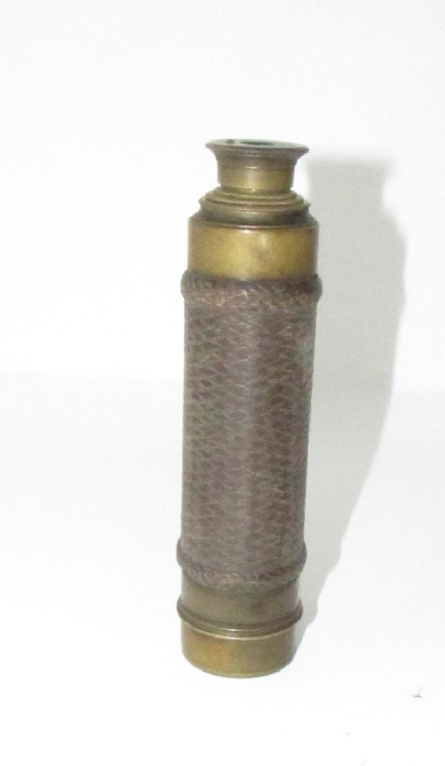 Antique Brass Wrapped in Leather Telescope: Approx. 1 1/2" in diameter , 6 1/4" long ( closed) and 15 3/4" long ( opened ) . No dents or dings