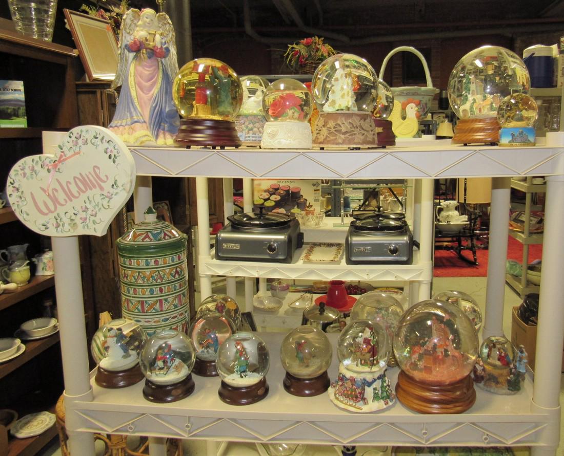 Two Shelves of Snow Globes and Misc.: Getting all pictured on 2 shelves. Largest snowglobe is approx 7" tall